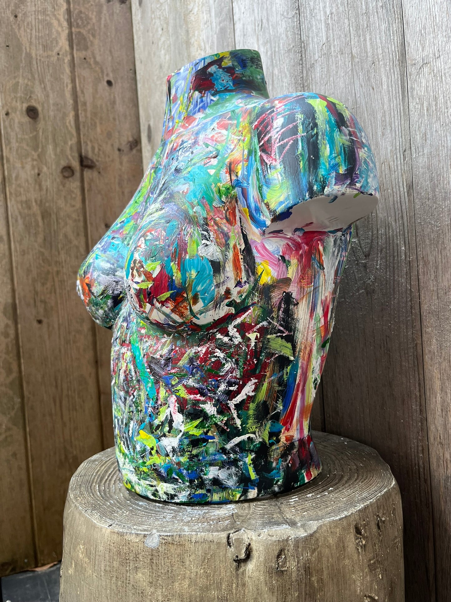 Bold and expressive female torso artwork painted on wood, showcasing vivid abstract textures by Cindy Trestman.